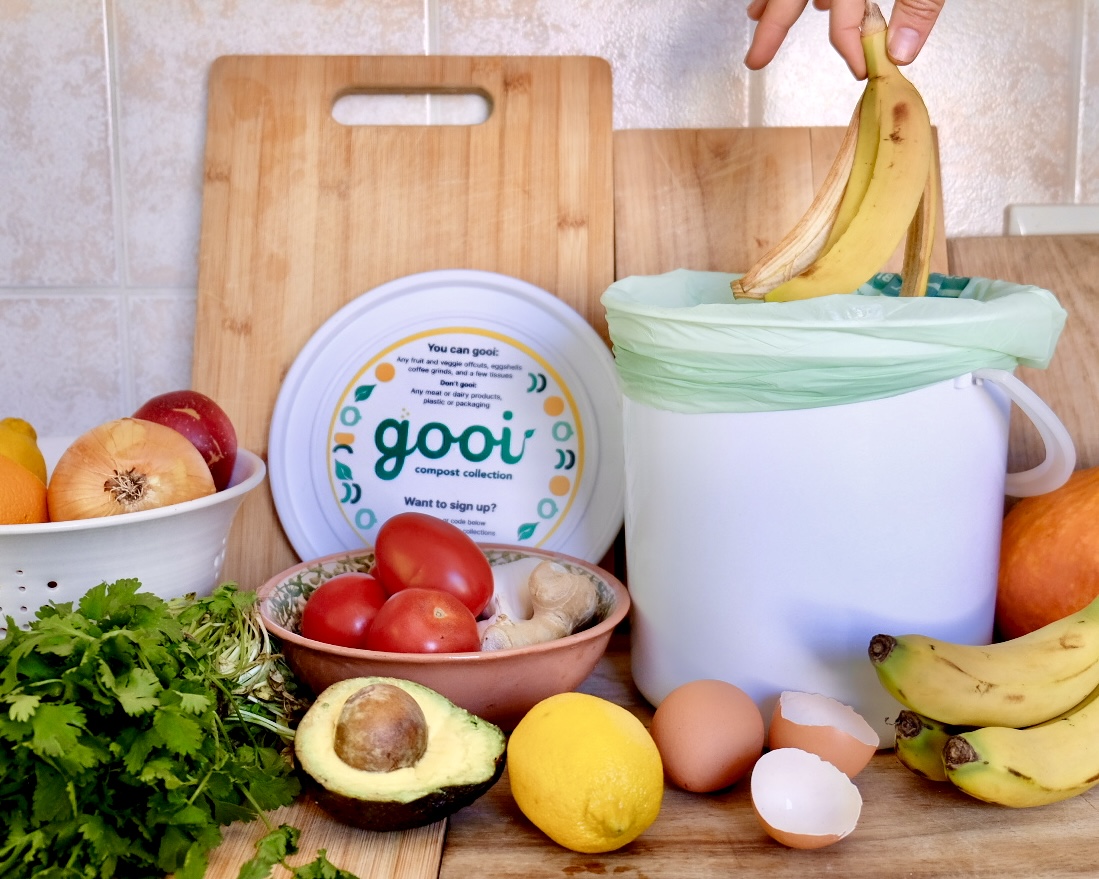 A gooi bucket full of kitchen scraps ready for collection